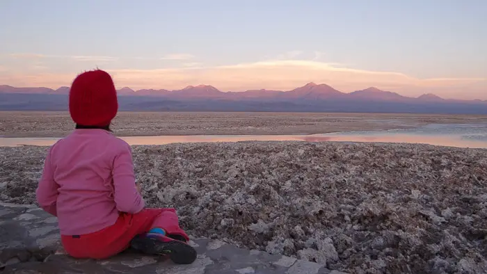 Child watching the sunset in the Atacama Desert